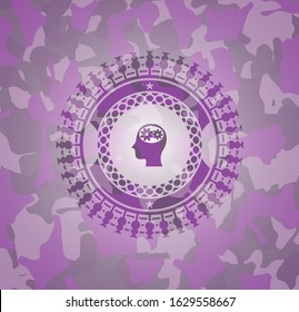 head with gears inside icon on pink and purple camouflage texture