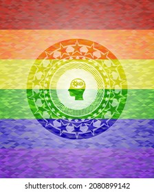 head with gears inside icon on mosaic background with the colors of the LGBT flag. 