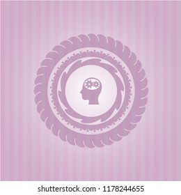head with gears inside icon inside pink emblem