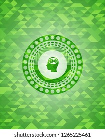 head with gears inside icon inside realistic green mosaic emblem