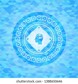 head with gears inside icon inside realistic light blue mosaic emblem