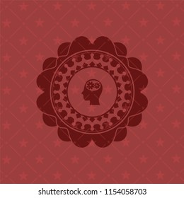 head with gears inside icon inside red icon or emblem