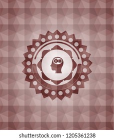 head with gears inside icon inside red seamless emblem or badge with abstract geometric pattern background.