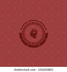 head with gears inside icon inside red icon or emblem