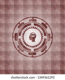 head with gears inside icon inside red seamless emblem with geometric pattern.