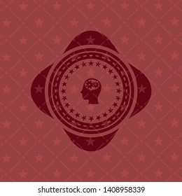 head with gears inside icon inside red icon or emblem
