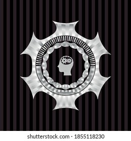 head with gears inside icon inside silver emblem. 