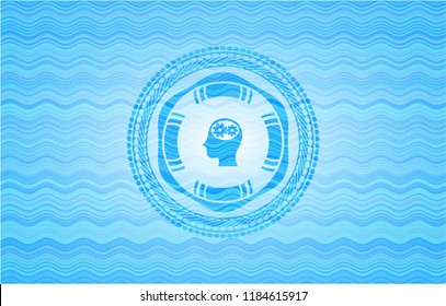 head with gears inside icon inside water wave emblem.