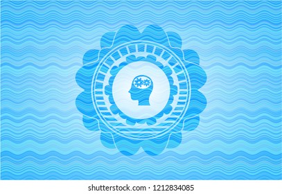 head with gears inside icon inside water representation badge.