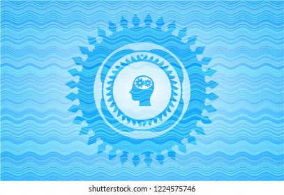 head with gears inside icon inside water emblem.