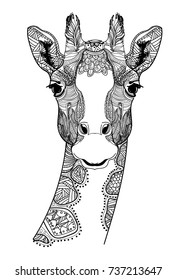 The head of a giraffe. Meditation, coloring of the mandala. Small horns and spots on the head. Drawing manually, templates. Strips, points, arrows. Spots of watercolor paint, spray.