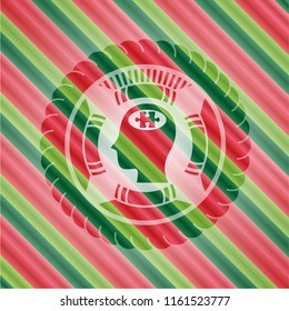 head with jigsaw puzzle piece icon inside christmas colors style badge.
