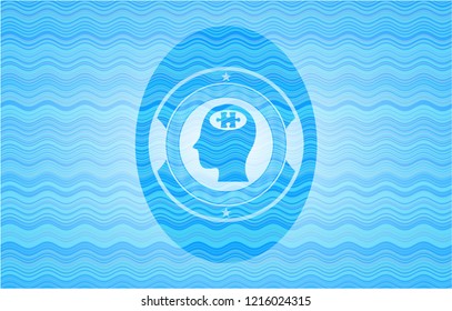head with jigsaw puzzle piece icon inside sky blue water wave emblem background.