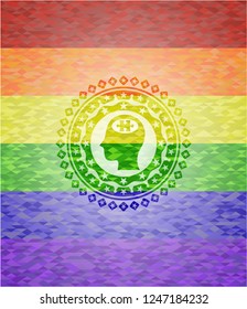 head with jigsaw puzzle piece icon on mosaic background with the colors of the LGBT flag