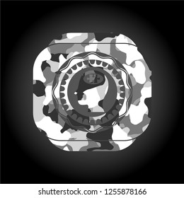 head with jigsaw puzzle piece icon on grey camouflaged pattern