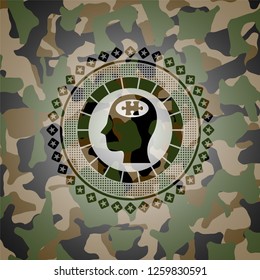 head with jigsaw puzzle piece icon on camouflage pattern