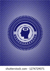 head with jigsaw puzzle piece icon inside emblem with jean texture