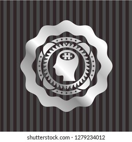 head with jigsaw puzzle piece icon inside silvery emblem or badge