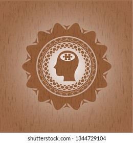 head with jigsaw puzzle piece icon inside wood emblem