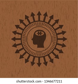 head with jigsaw puzzle piece icon inside wood badge or emblem