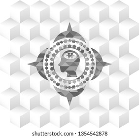 head with jigsaw puzzle piece icon inside grey badge with geometric cube white background