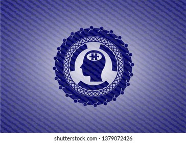 head with jigsaw puzzle piece icon inside badge with denim background
