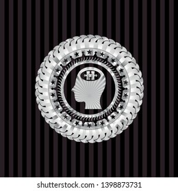 head with jigsaw puzzle piece icon inside silver shiny badge