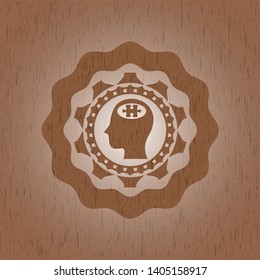 head with jigsaw puzzle piece icon inside wood badge or emblem