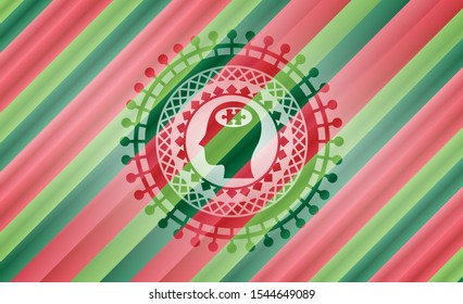 head with jigsaw puzzle piece icon inside christmas badge.