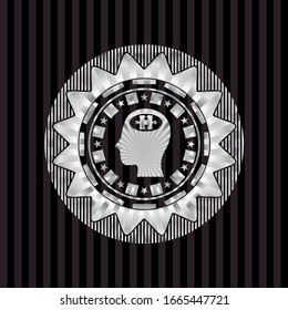 head with jigsaw puzzle piece icon inside silvery badge