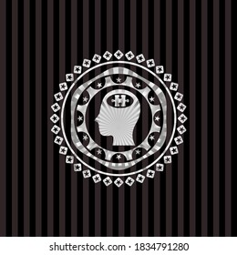 head with jigsaw puzzle piece icon inside silver emblem or badge. 