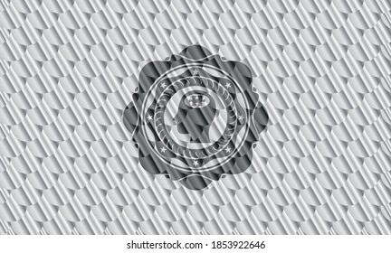 head with jigsaw puzzle piece icon inside shiny silver badge. Scales pattern. Vector Illustration. Detailed. 