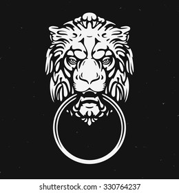 The head of a lion with a ring in his mouth. Logo design, vector template.