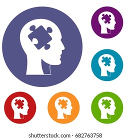 Head with puzzle icons set in flat circle red, blue and green color for web