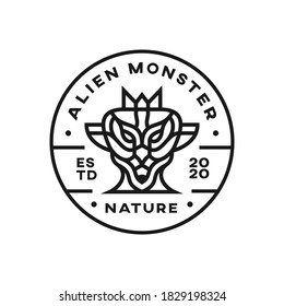 The head of a scary alien monster. The extraterrestrial character of the moon or mars. Retro and vintage style badge logo design.