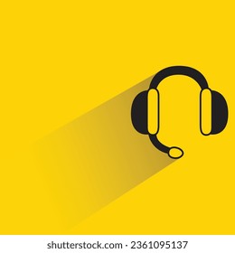 headphone and mic with shadow on yellow background