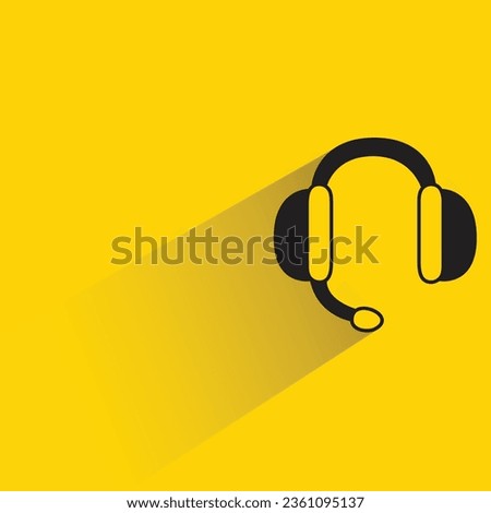 headphone and mic with shadow on yellow background