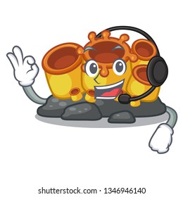 With headphone orange sponge coral in shape mascot