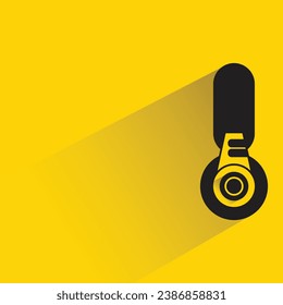 headphone with shadow on yellow background