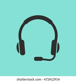 Headphone vector icon. Black illustration isolated on green background for graphic and web design.