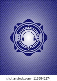 headphones icon inside badge with denim texture