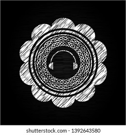 headphones icon inside chalkboard emblem on black board