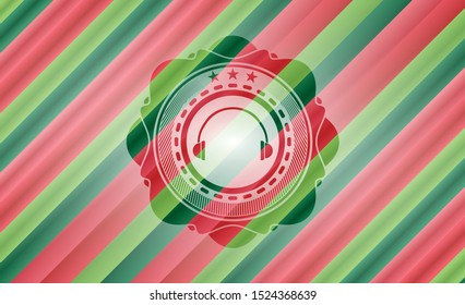 headphones icon inside christmas colors emblem.