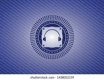 headphones icon inside emblem with denim texture