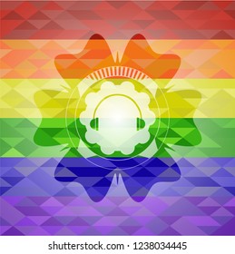 headphones icon inside emblem on mosaic background with the colors of the LGBT flag