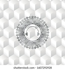headphones icon inside grey emblem. Retro with geometric cube white background