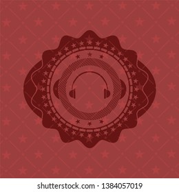 headphones icon inside red icon or emblem