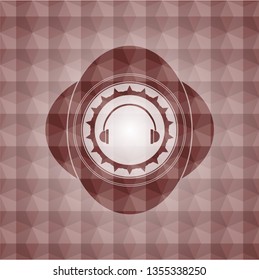 headphones icon inside red seamless emblem with geometric pattern.