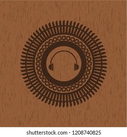 headphones icon inside retro style wood emblem