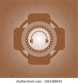 headphones icon inside retro style wooden emblem